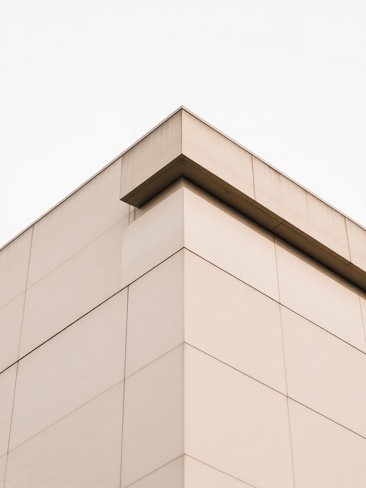 Concrete architectural detail against a pale sky